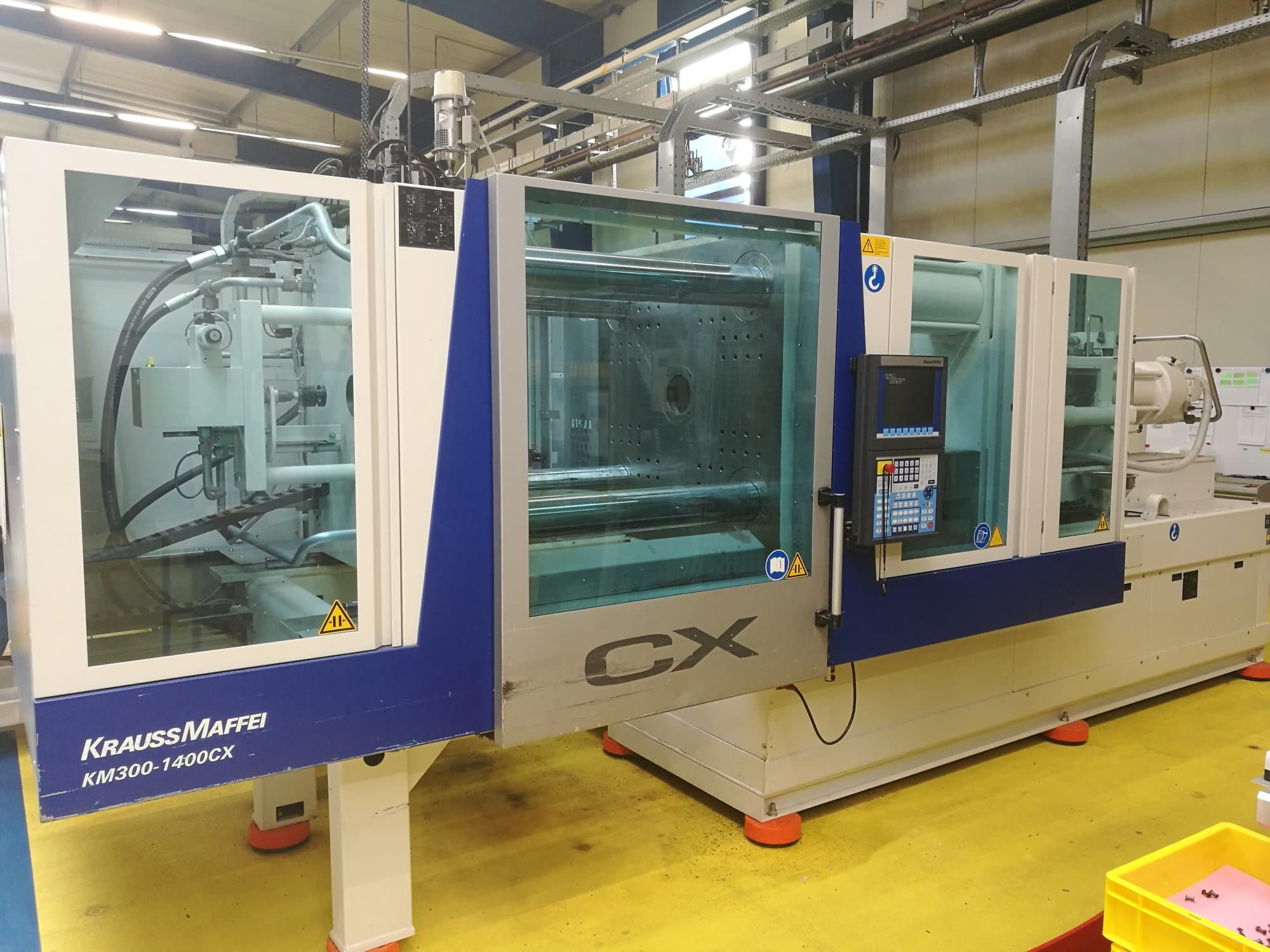 Mašīnas Krauss Maffei 300-1400 CX  pretskats