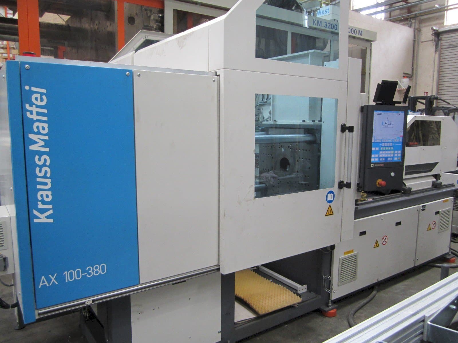 Mašīnas Krauss Maffei 100-380 AX  pretskats