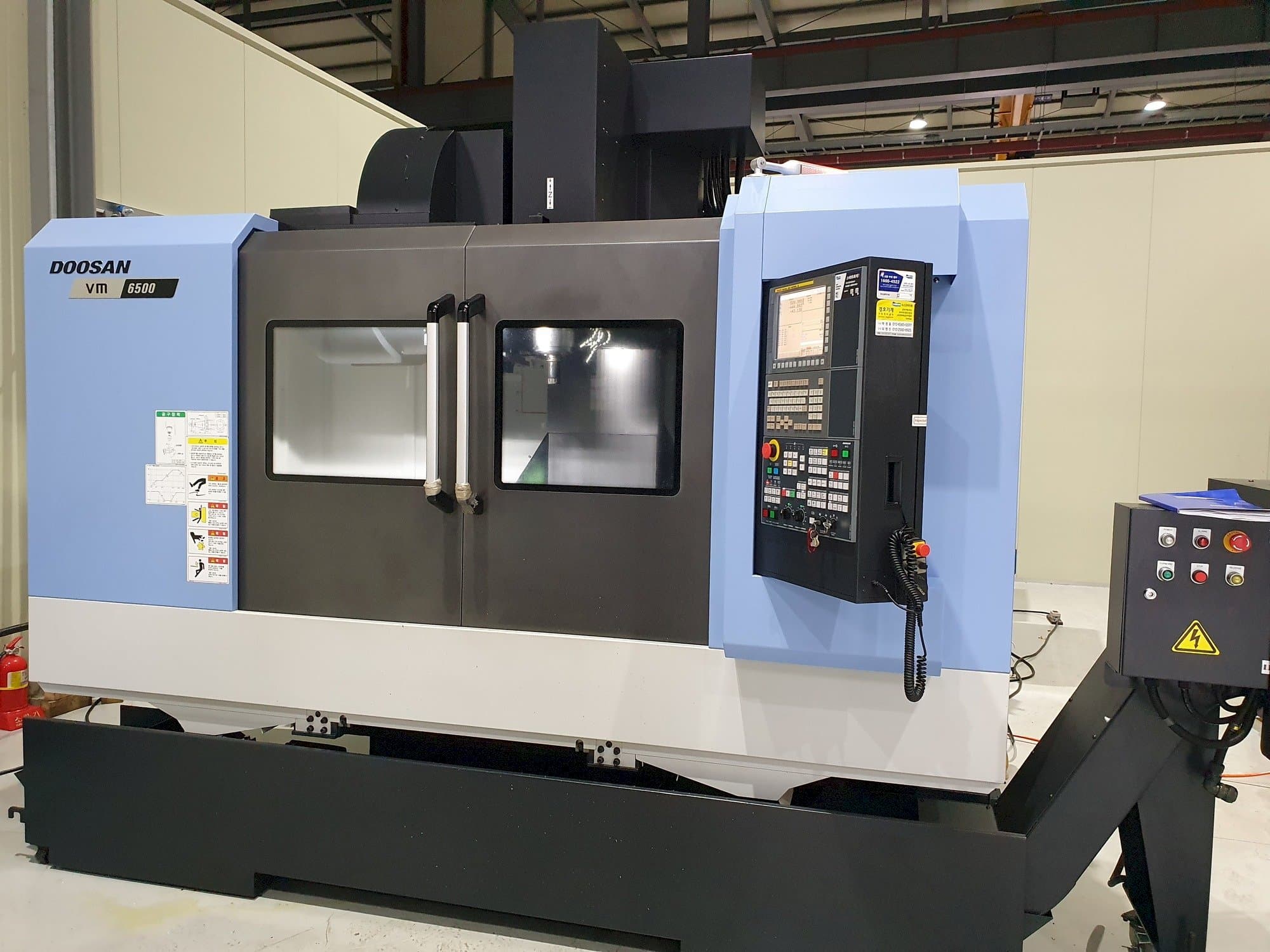 Mašīnas Doosan VM6500  pretskats