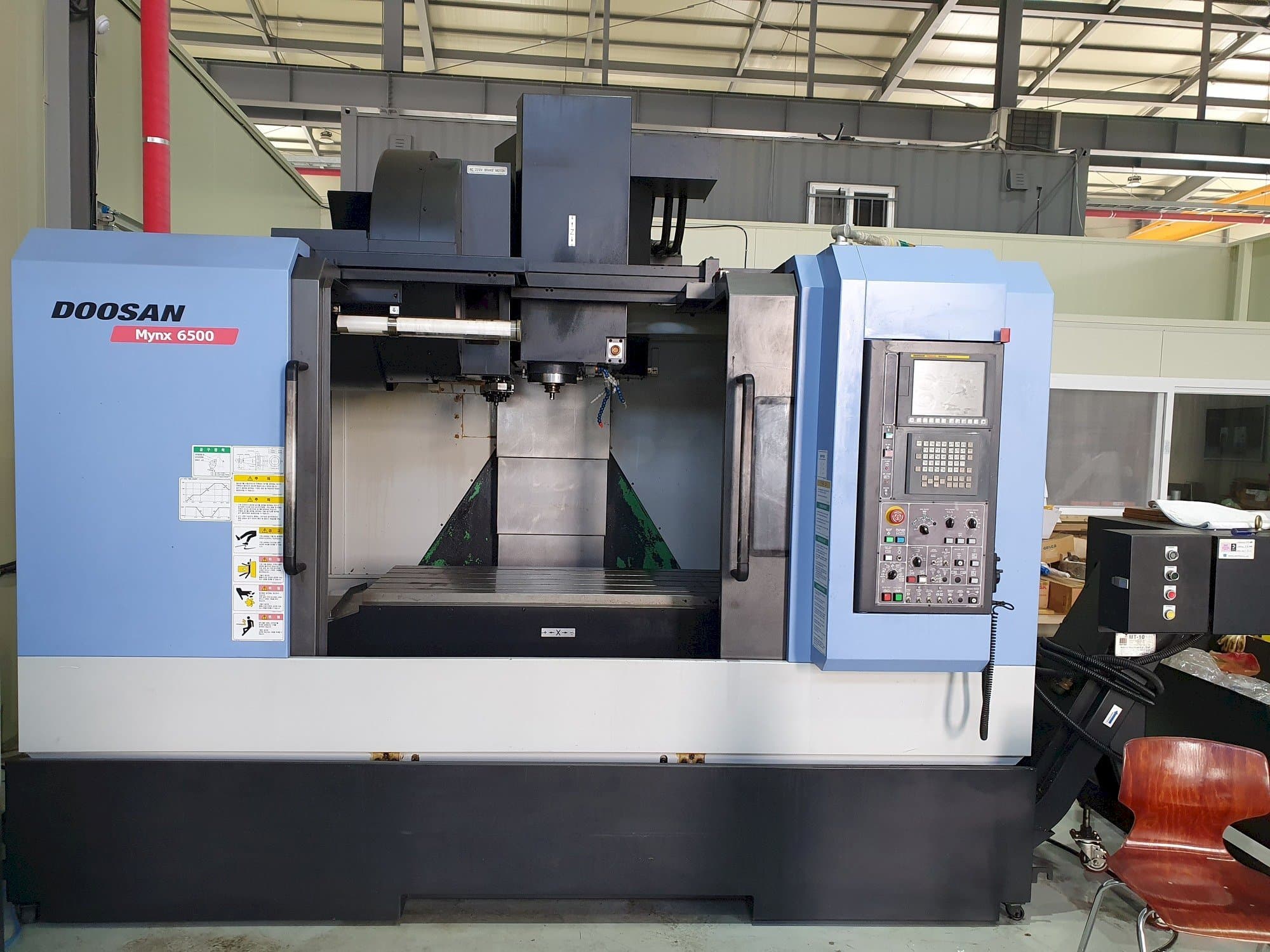 Mašīnas Doosan MYNX 6500  pretskats