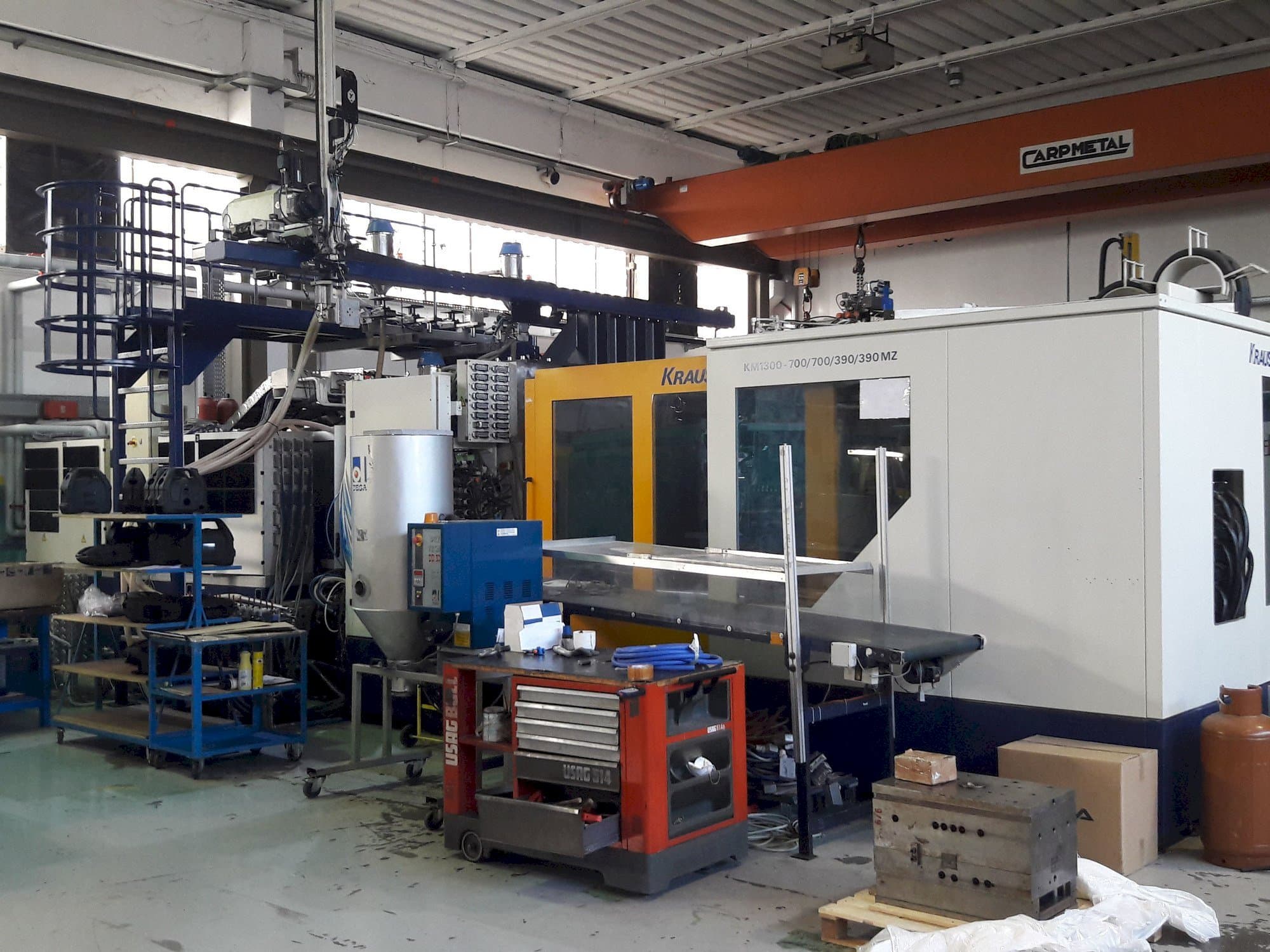 Mašīnas Krauss Maffei 1300-700-700-390-390 MZ  pretskats