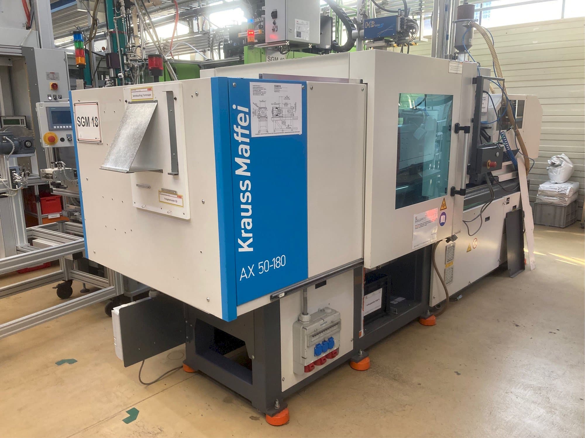 Mašīnas Krauss Maffei AX 50-180 kreisās malas  skats