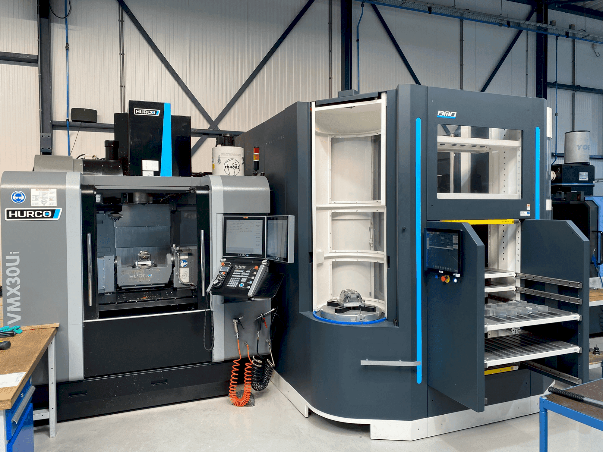 Mašīnas Hurco VMX30Ui + BMO Automation Titanium 50  pretskats