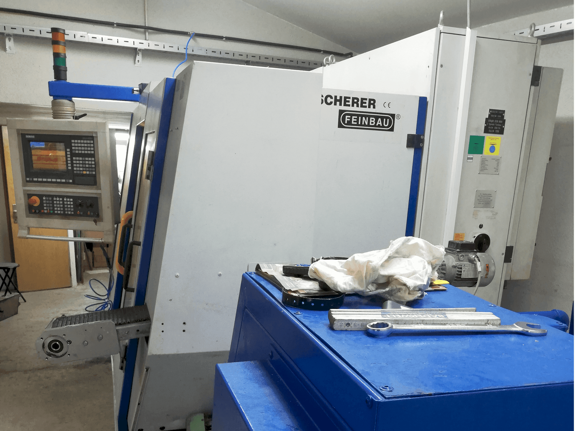 Mašīnas Scherer - Feinbau CNC244/2  pretskats