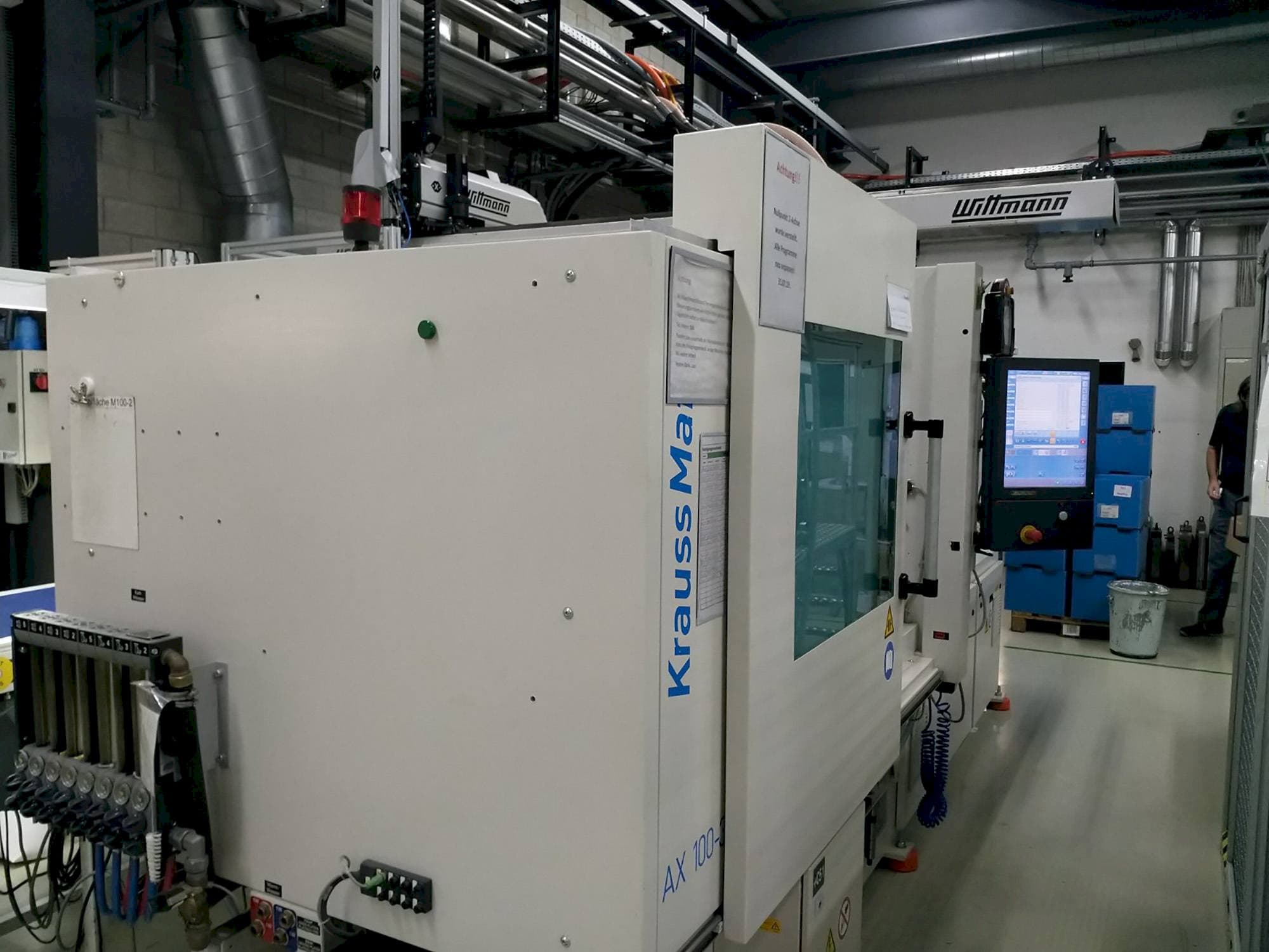 Mašīnas Krauss Maffei 100-380 AX  pretskats