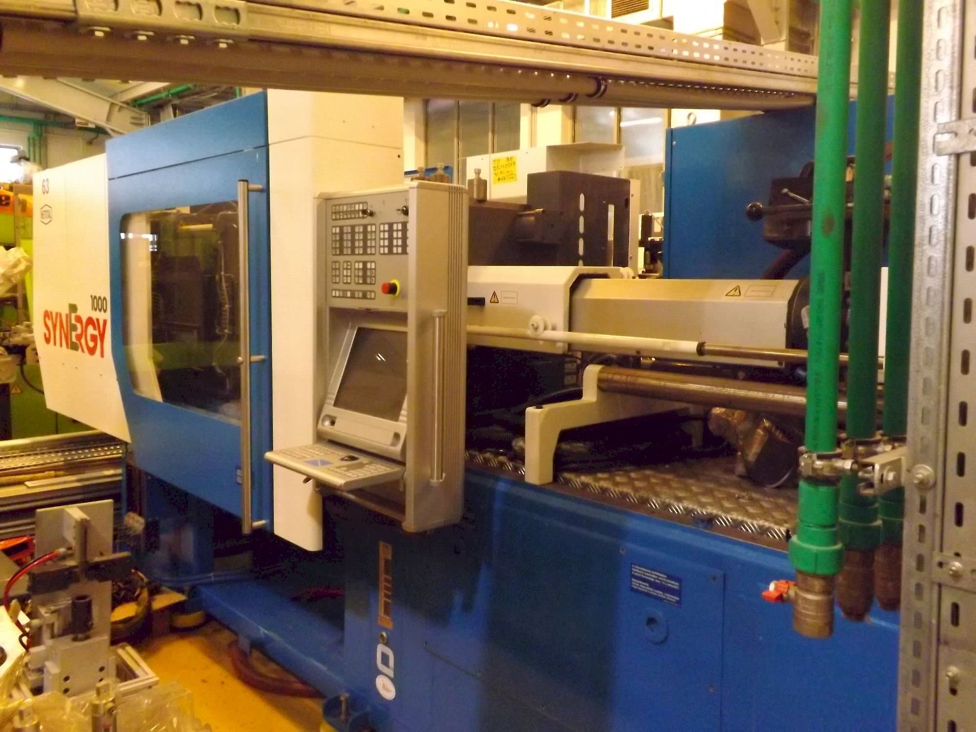 Mašīnas Netstal Synergy 1000 230-110  pretskats