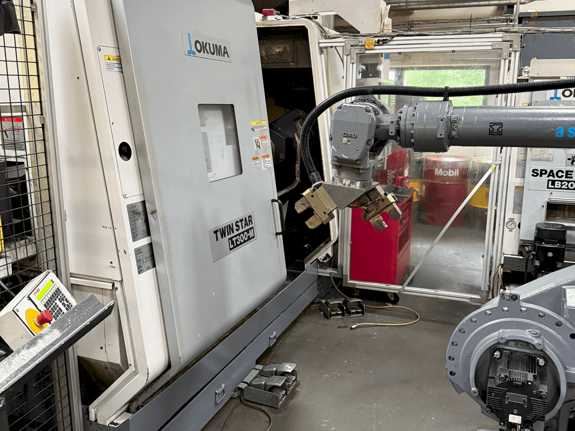 Mašīnas Okuma Twinstar LT300-M  pretskats