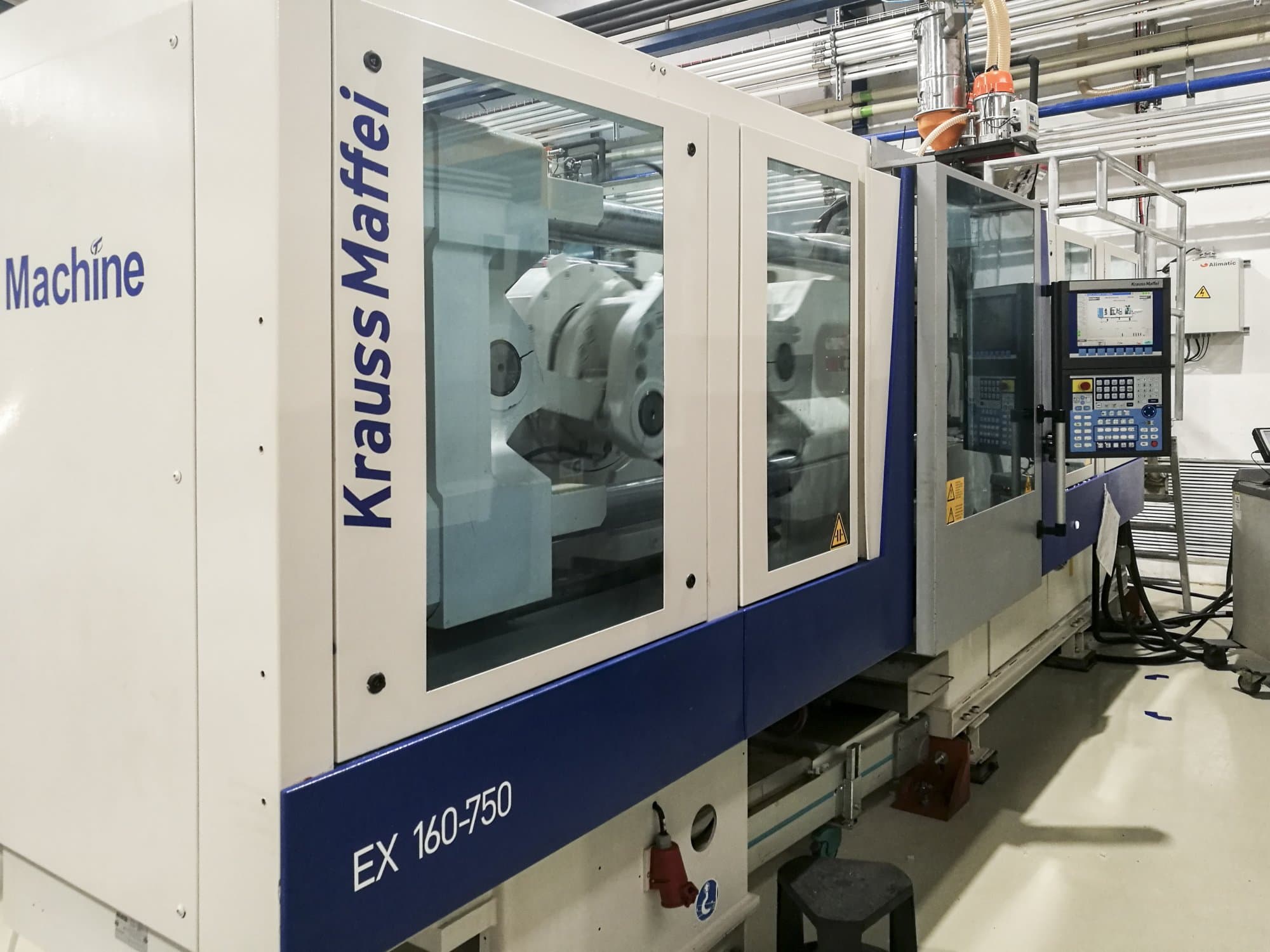Mašīnas Krauss Maffei 160-750 EX skats  no kreisās puses