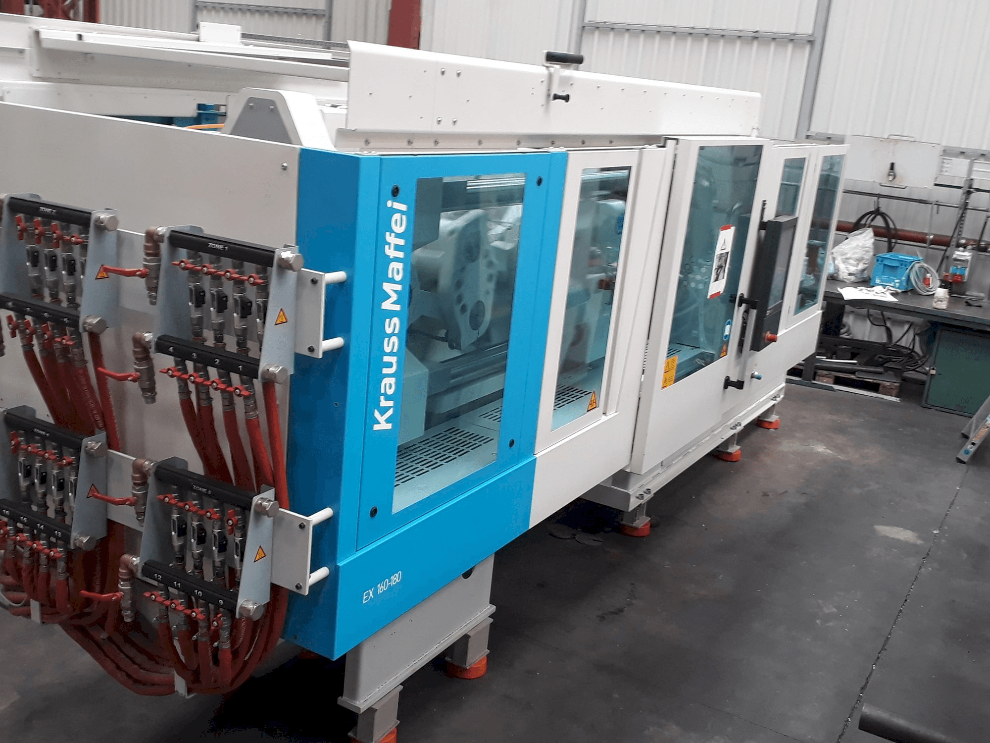 Mašīnas Krauss Maffei 160-180 EX kreisās malas skats