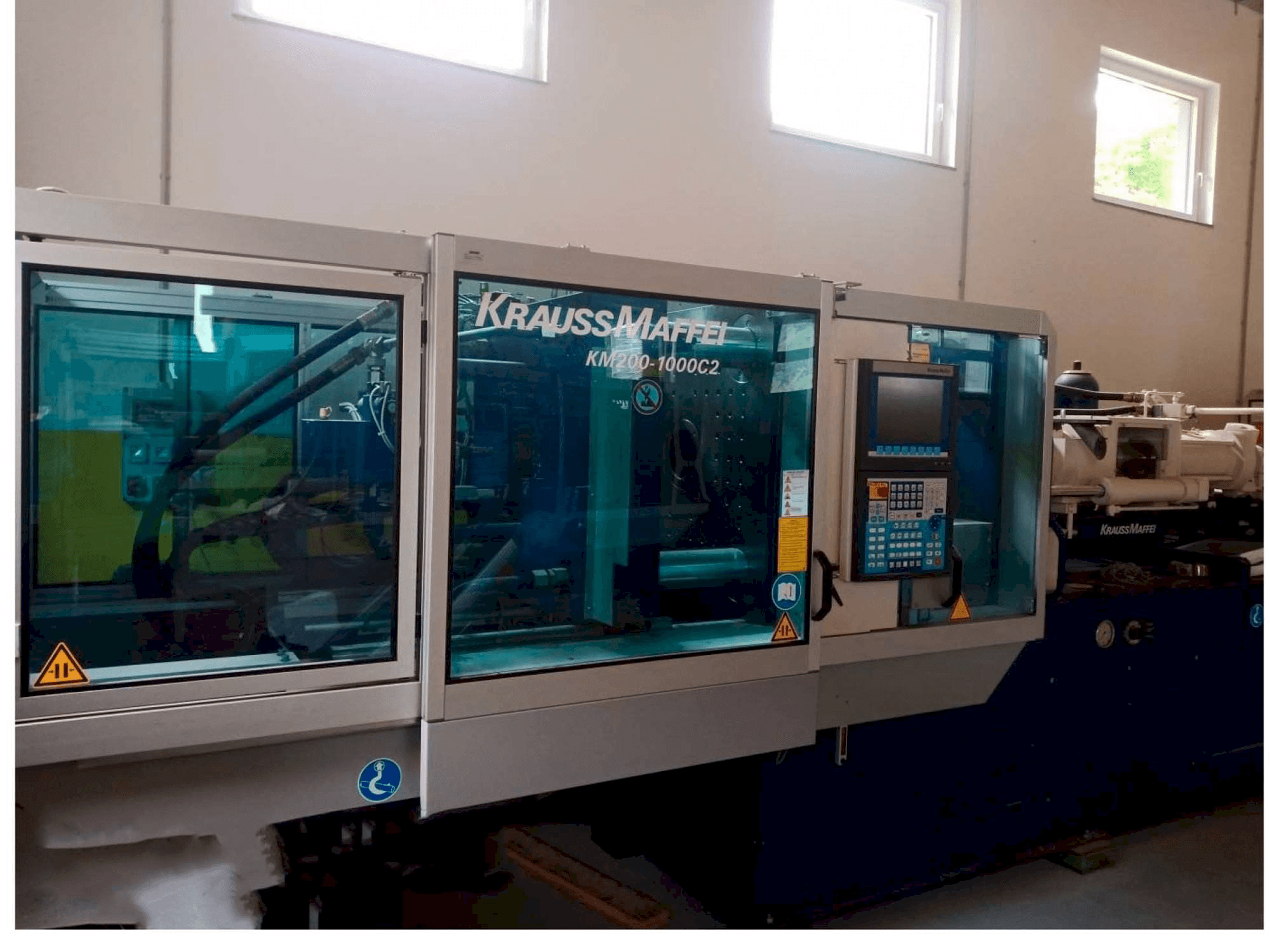 Mašīnas Krauss Maffei KM 200/1000 pretskats