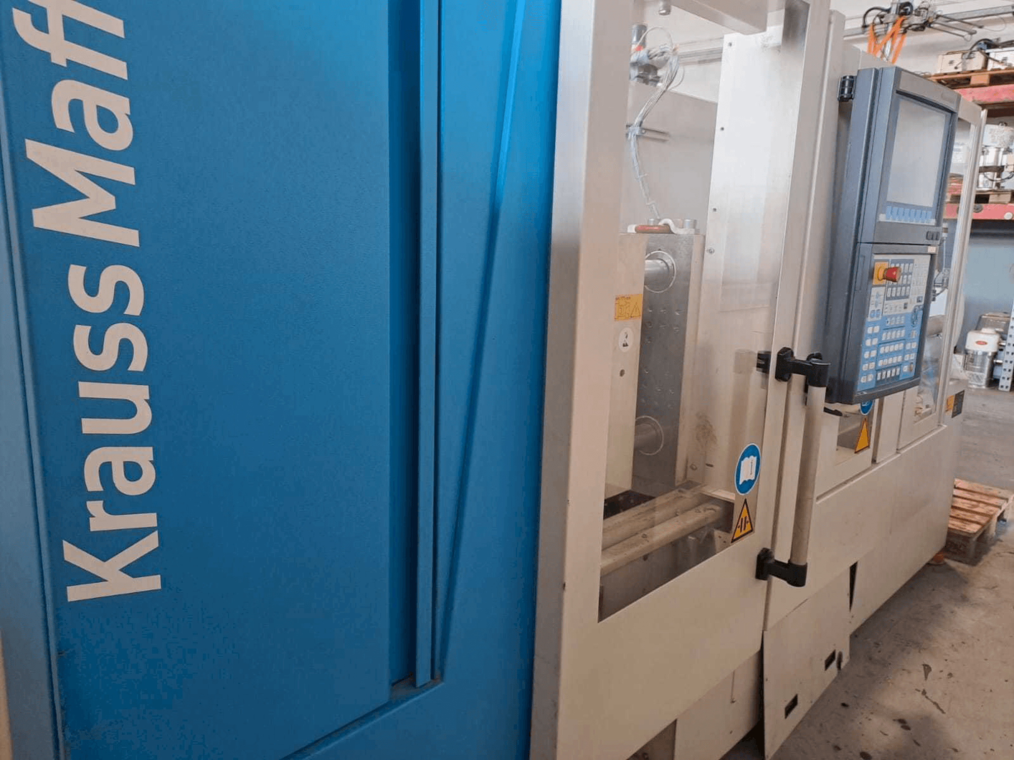 Mašīnas Krauss Maffei 35-180CX pretskats